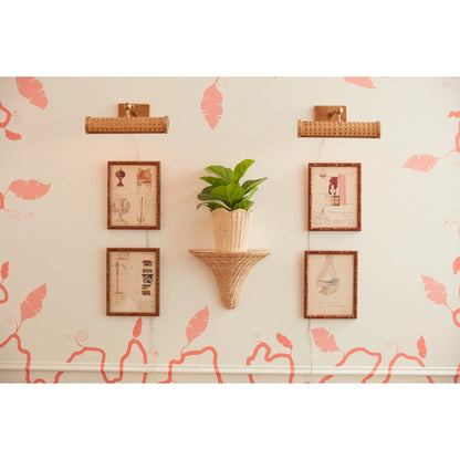 Cane Picture Light by Chelsea House in gold. Made from brass, wicker in a rustic style.