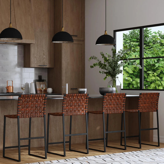 Urban Counter Stool by Butler Specialty Company in medium brown and brown leather. Made from iron, real leather, steel metal nail heads in a modern style.