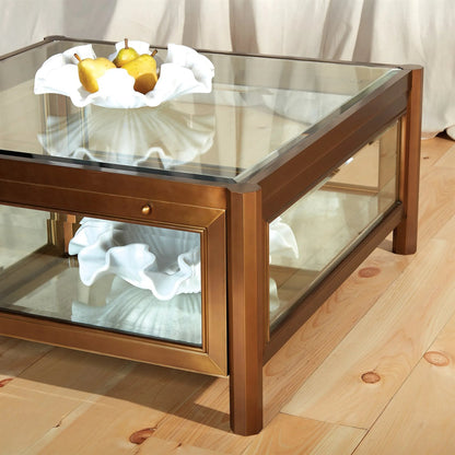 Apothecary Cocktail Table by Global Views in dark brass. Made from poplar, beveled glass in a transitional style.