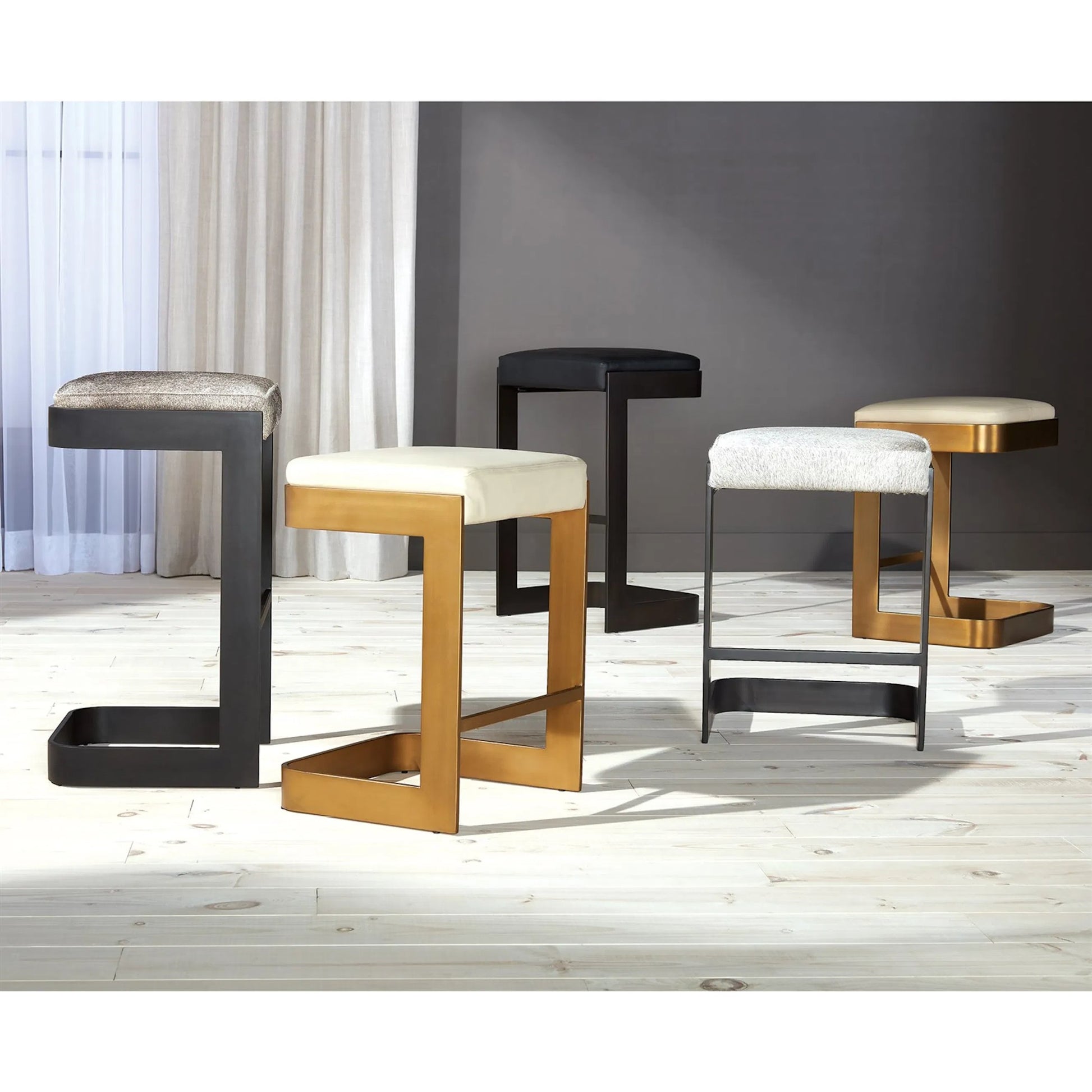 Regan Low Bar Stool with Grey Hair by Global Views. Made from iron in a modern style.