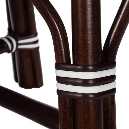 Marcella Rattan Bench by Butler Specialty Company in dark brown and black. Made from natural bamboo, polyethelene synthetic rattan weave in a coastal style.