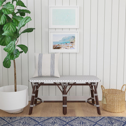 Marcella Rattan Bench by Butler Specialty Company in dark brown and black. Made from natural bamboo, polyethelene synthetic rattan weave in a coastal style.