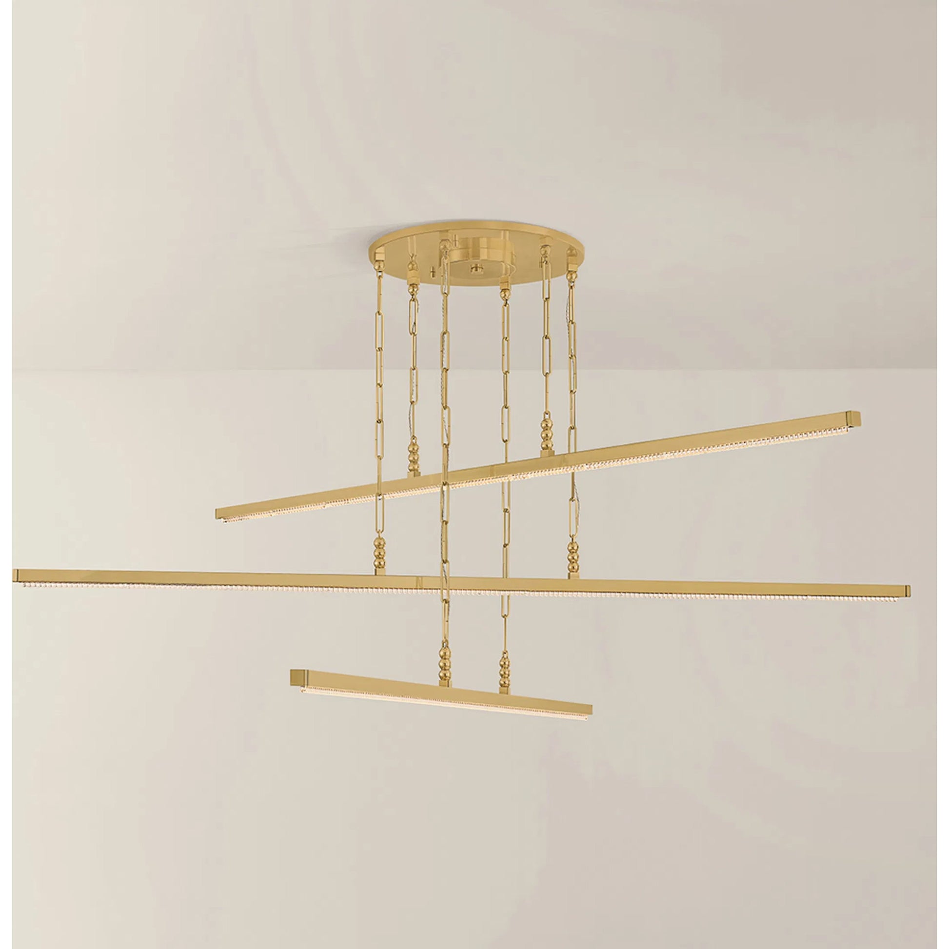 Cortina Chandelier by Corbett in vintage brass. Made from unique in a modern style.