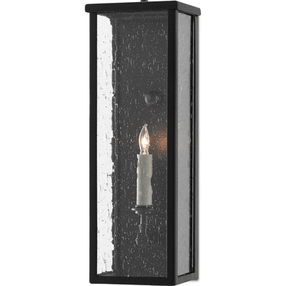 Tanzy Outdoor Wall Sconce by Currey and Company in midnight. Made from wrought iron, seeded glass in a transitional style.
