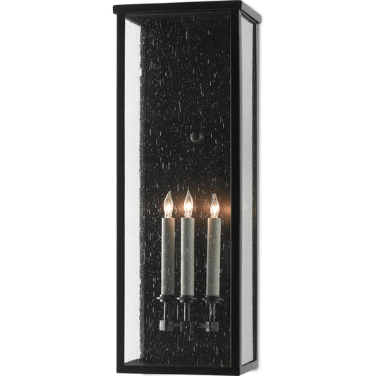 Tanzy Outdoor Wall Sconce by Currey and Company in midnight. Made from wrought iron, seeded glass in a transitional style.