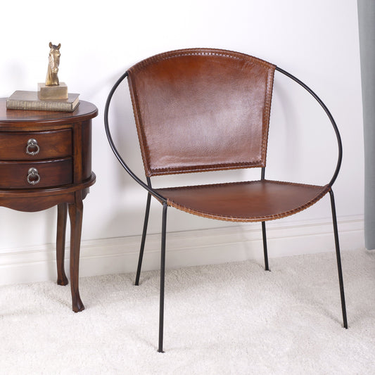 Milo Accent Chair by Butler Specialty Company in brown and brown leather. Made from leather goat, iron frame, urethane foam in a modern style.