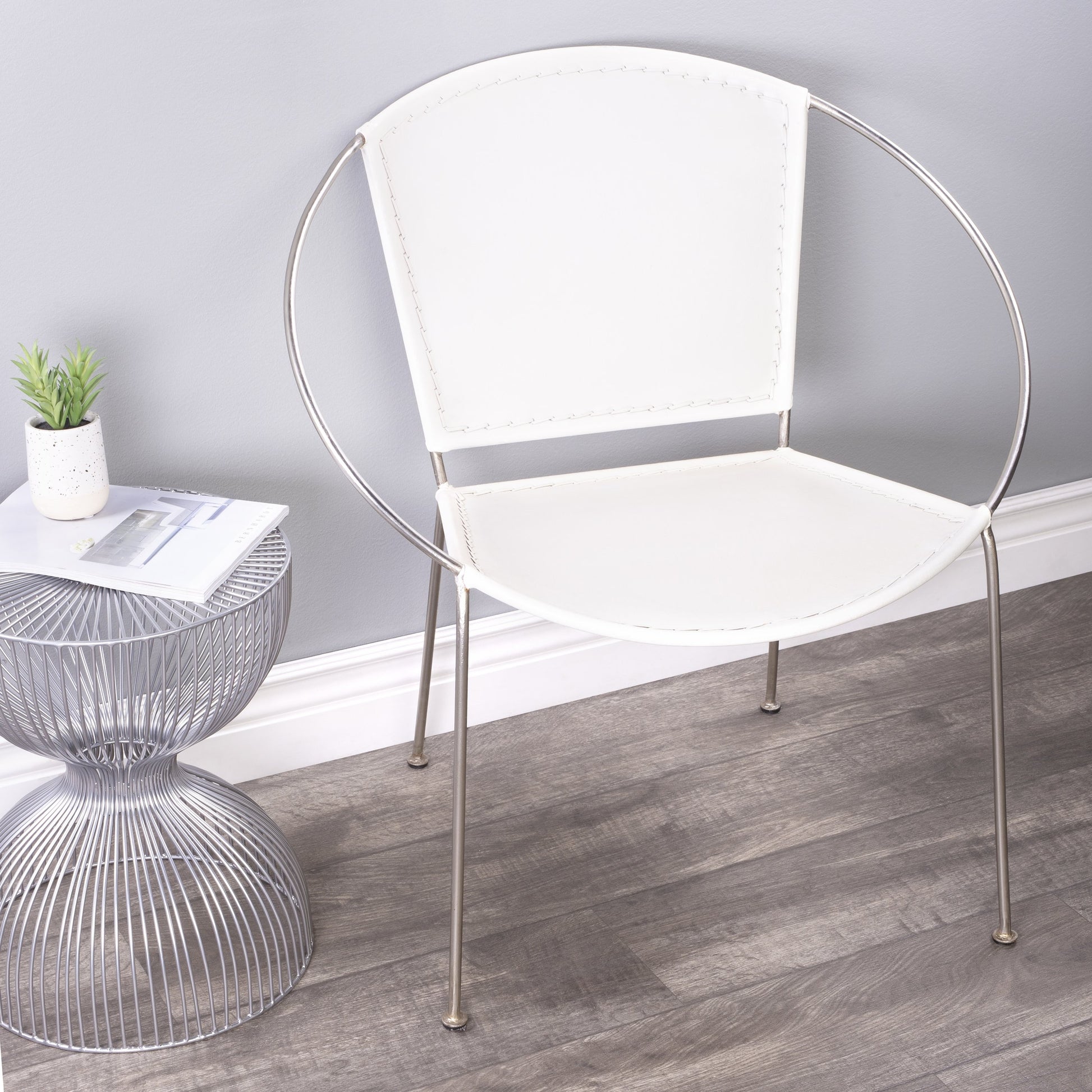 Milo Accent Chair by Butler Specialty Company in brown and brown leather. Made from leather goat, iron frame, urethane foam in a modern style.