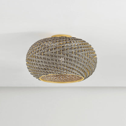 Penarth Flush Mount by Hudson Valley in aged brass. Made from natural woven in a rustic style.