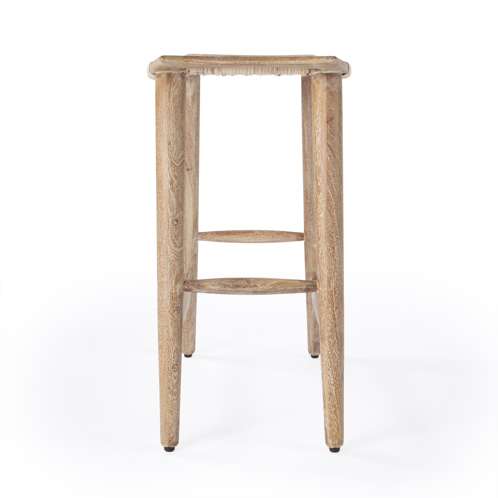 Tristan Counter Stool by Butler Specialty Company in natural wood and natural mango. Made from mango wood solids, woven cane in a coastal style.