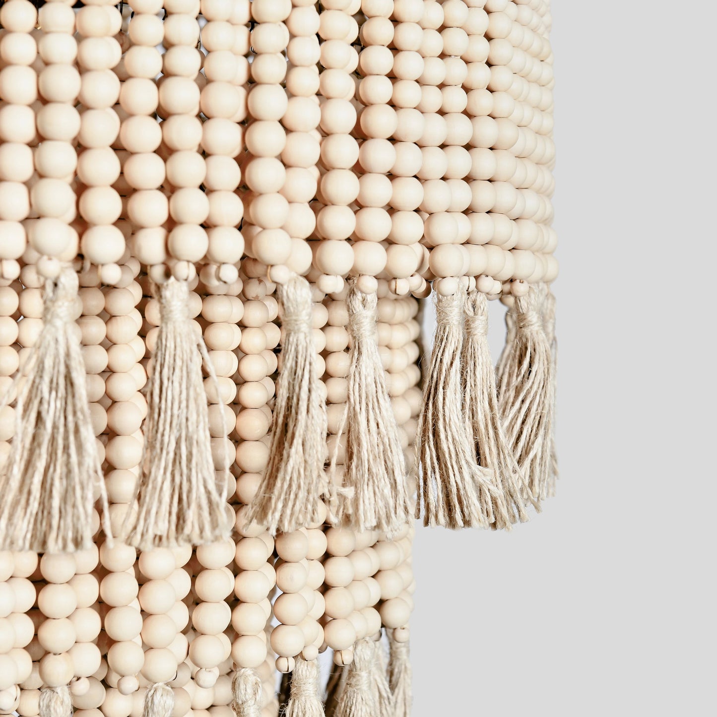 004 SI-2162530 | Closeup | Brittany Natural Beaded Chandelier by Classic Home in natural. Made from wood beads in a cottage & farmhouse style.