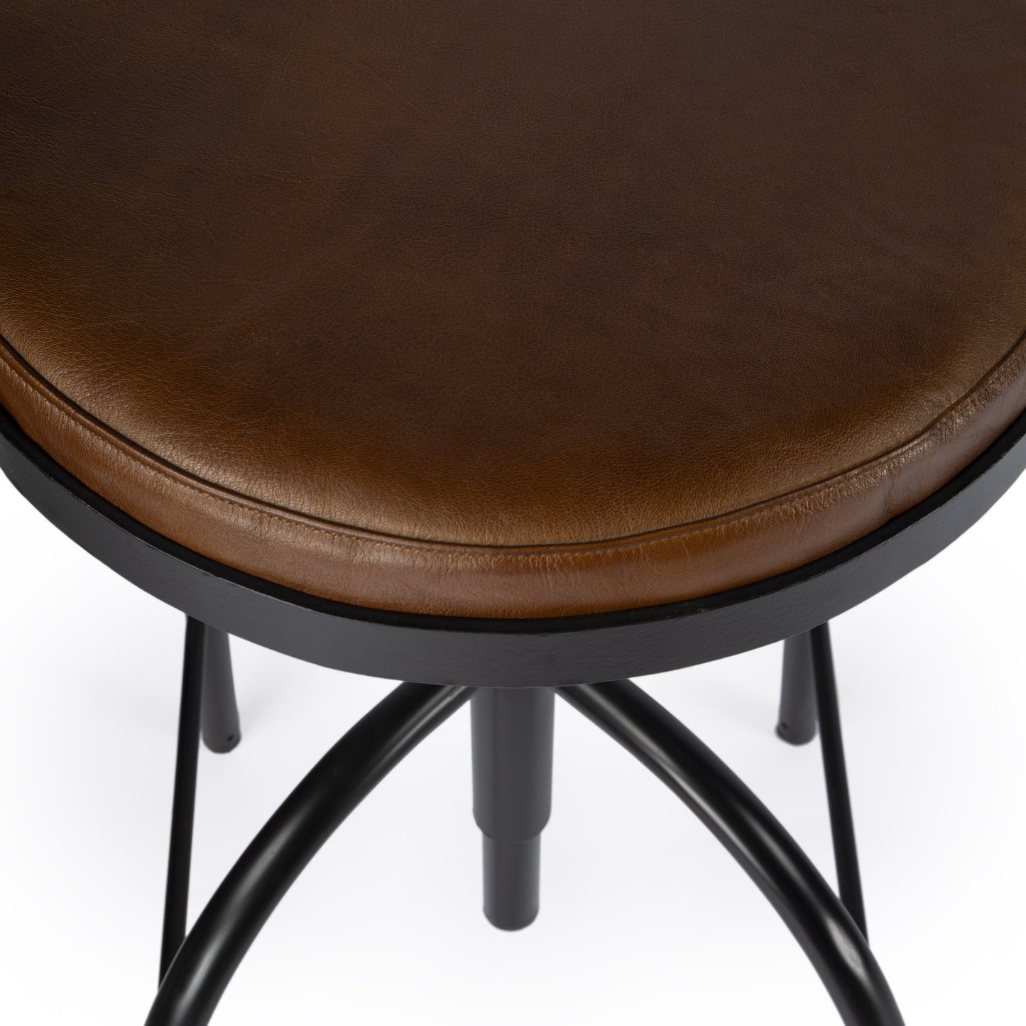 006 SI-1822255 | Closeup | Clyde Bar Stool by Butler Specialty Company in brown and brown leather. Made from iron, brown leather, fr foam in a modern style.