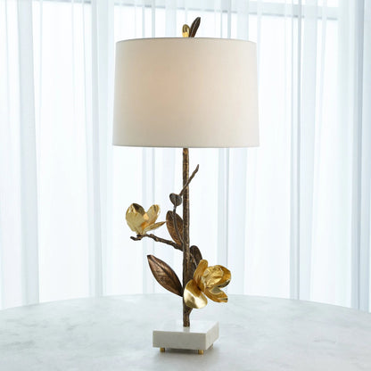 Magnolia Flower Table Lamp by Global Views in antique brass, gold. Made from brass, marble in a modern style.