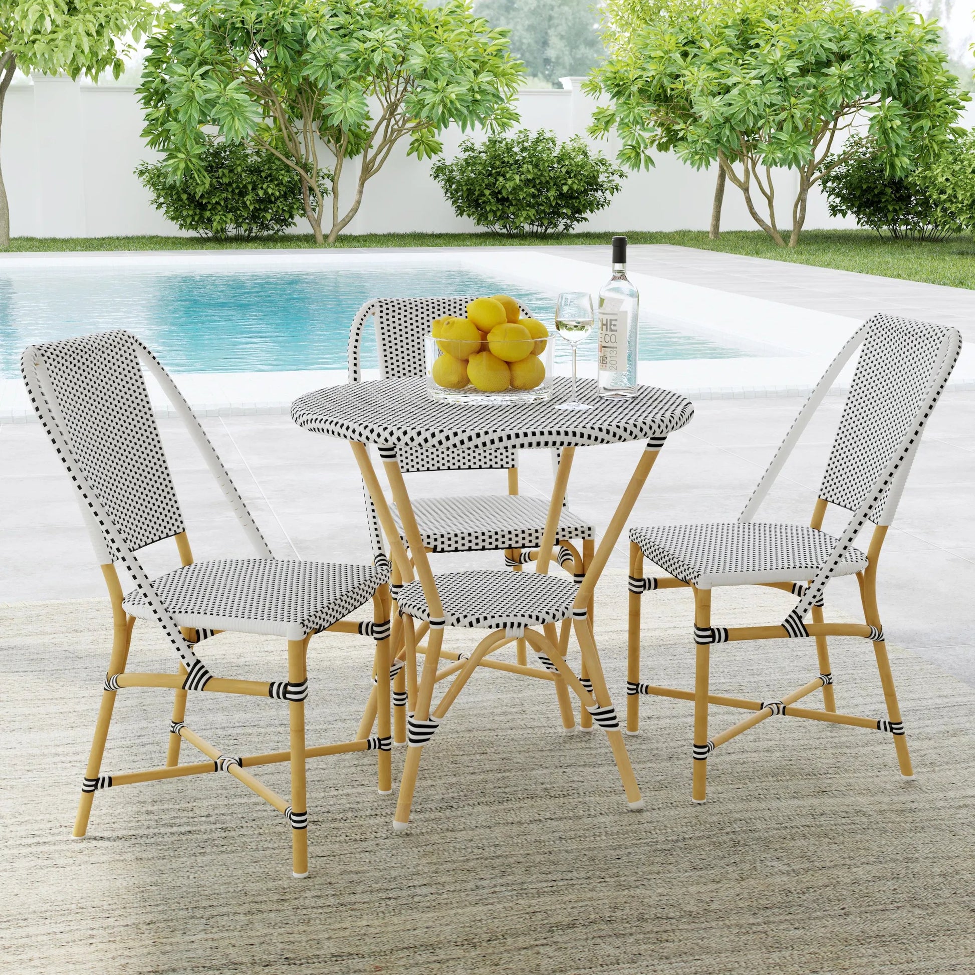 Tobias Outdoor Rattan Round Bistro Table by Butler Specialty Company. Made from polyethylene rattan weave, metal in a coastal style.