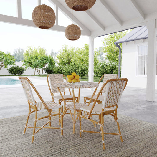 Tobias Outdoor Rattan Dining Chair by Butler Specialty Company. Made from polyethylene rattan weave, metal in a coastal style.