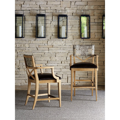 Sutherland Upholstered Bar Stool by Tommy Bahama Home in natural. Made from unique in a coastal style.