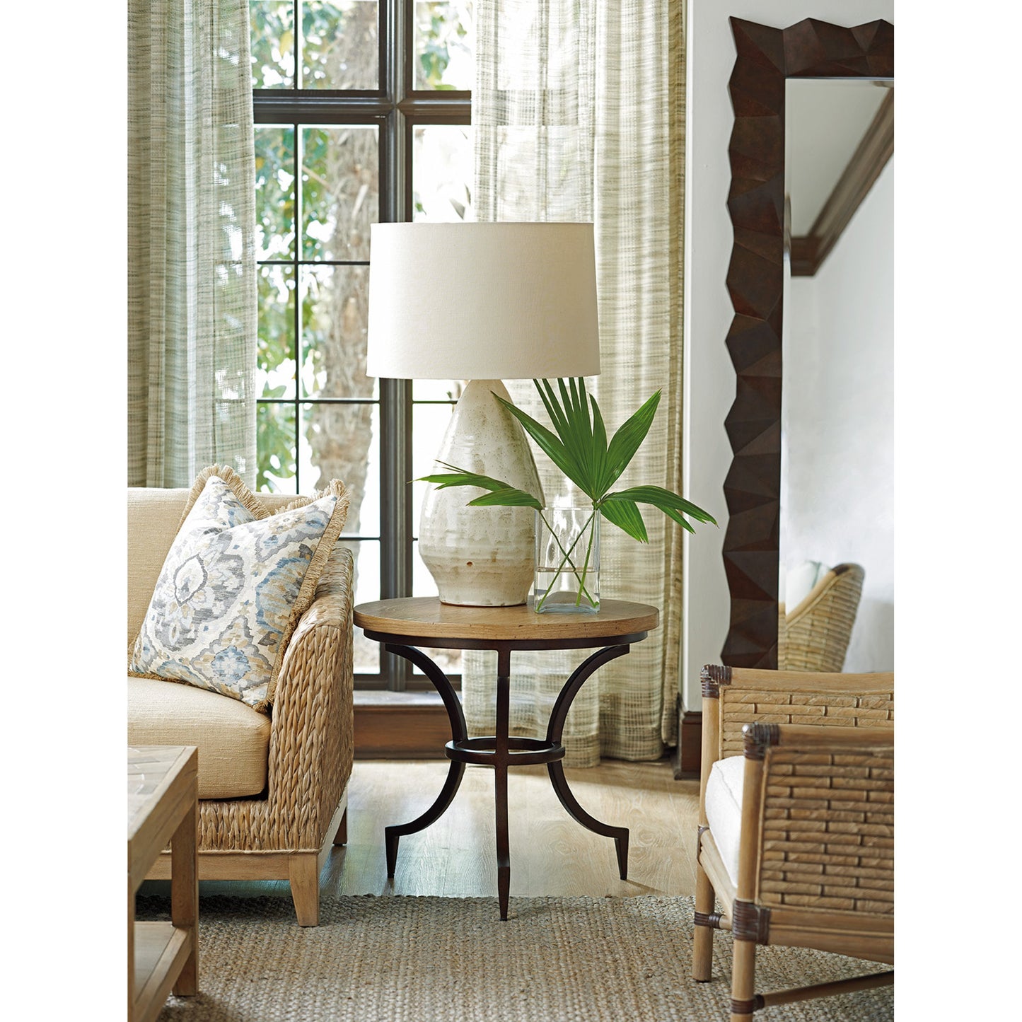 003 SR-836107 | Lifestyle | Flemming Round End Table by Tommy Bahama Home. Made from unique in a transitional style.