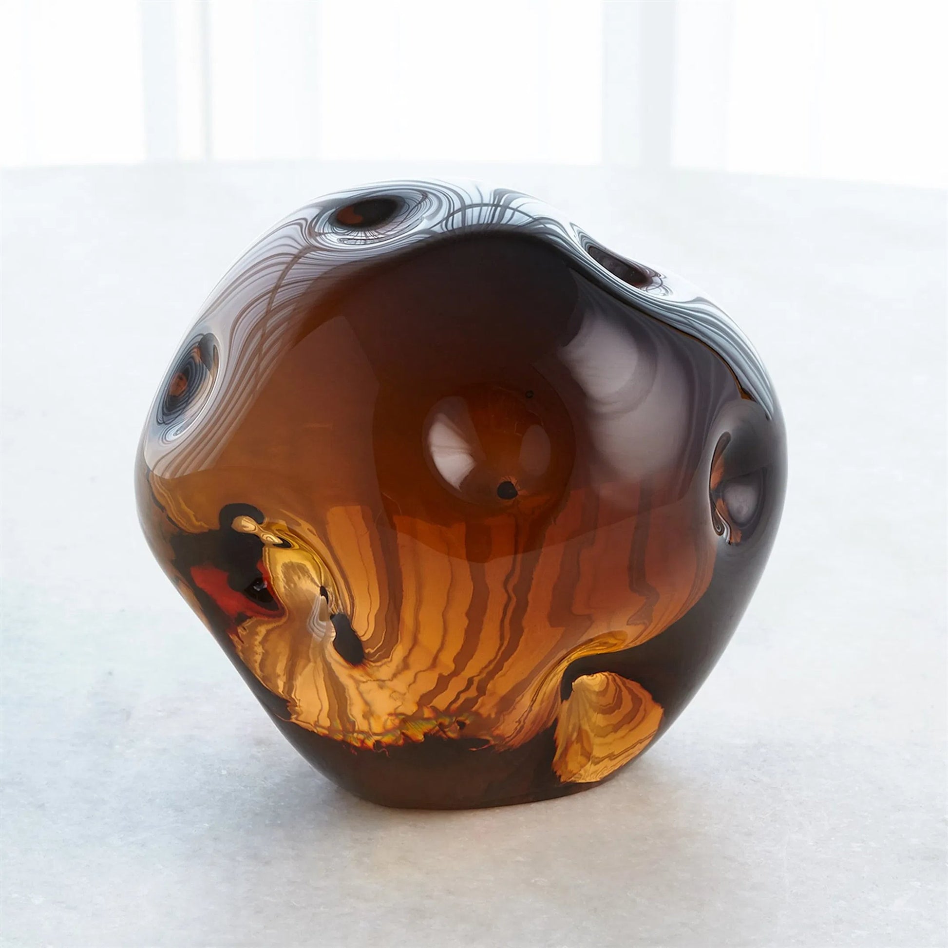 Dimpled Sphere by Global Views. Made from art glass in a eclectic & global style.