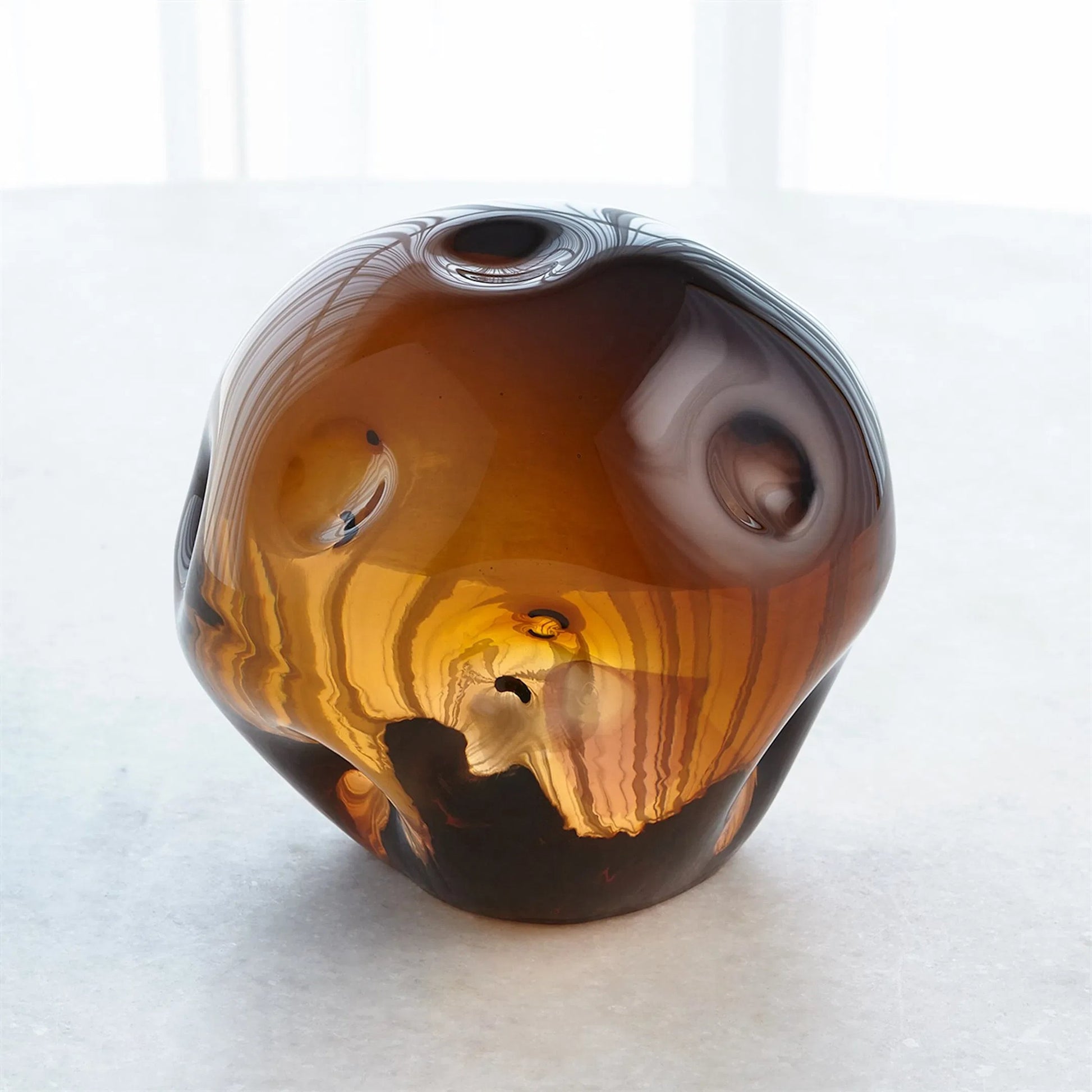 Dimpled Sphere by Global Views. Made from art glass in a eclectic & global style.