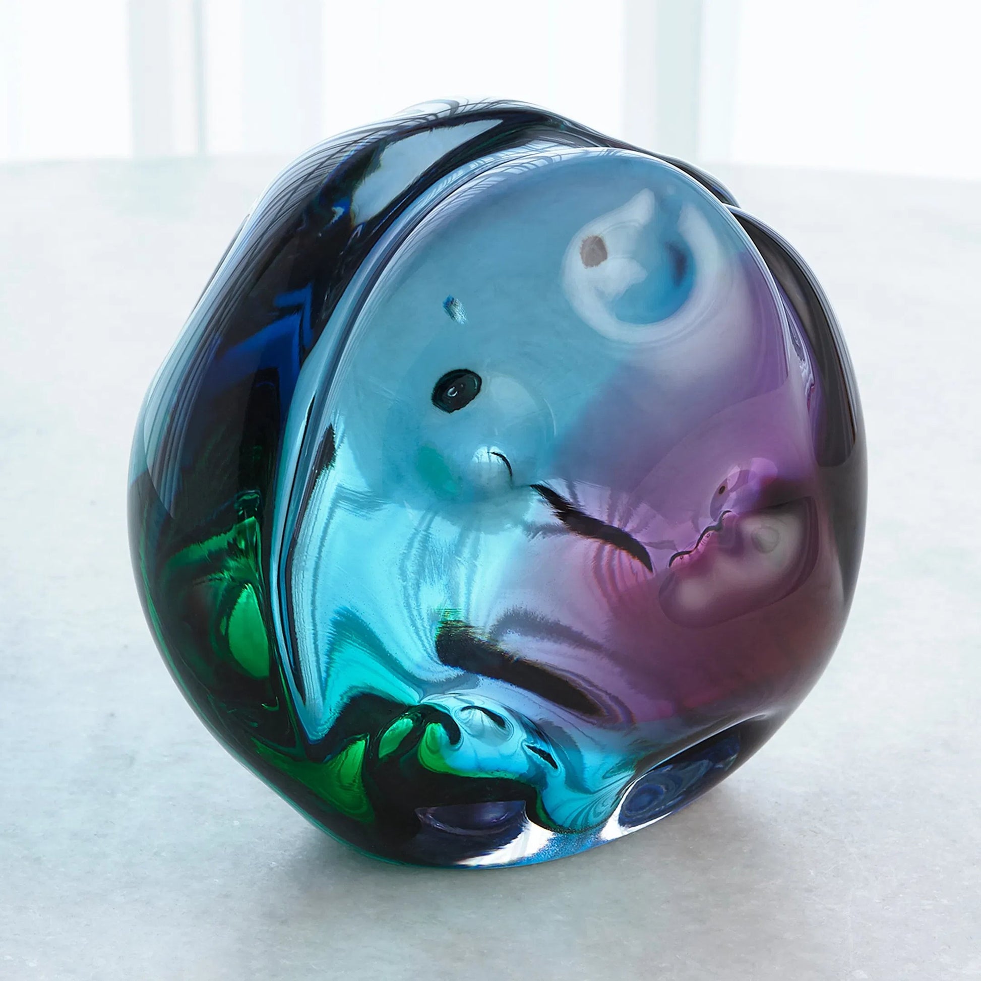 Dimpled Sphere by Global Views. Made from art glass in a eclectic & global style.