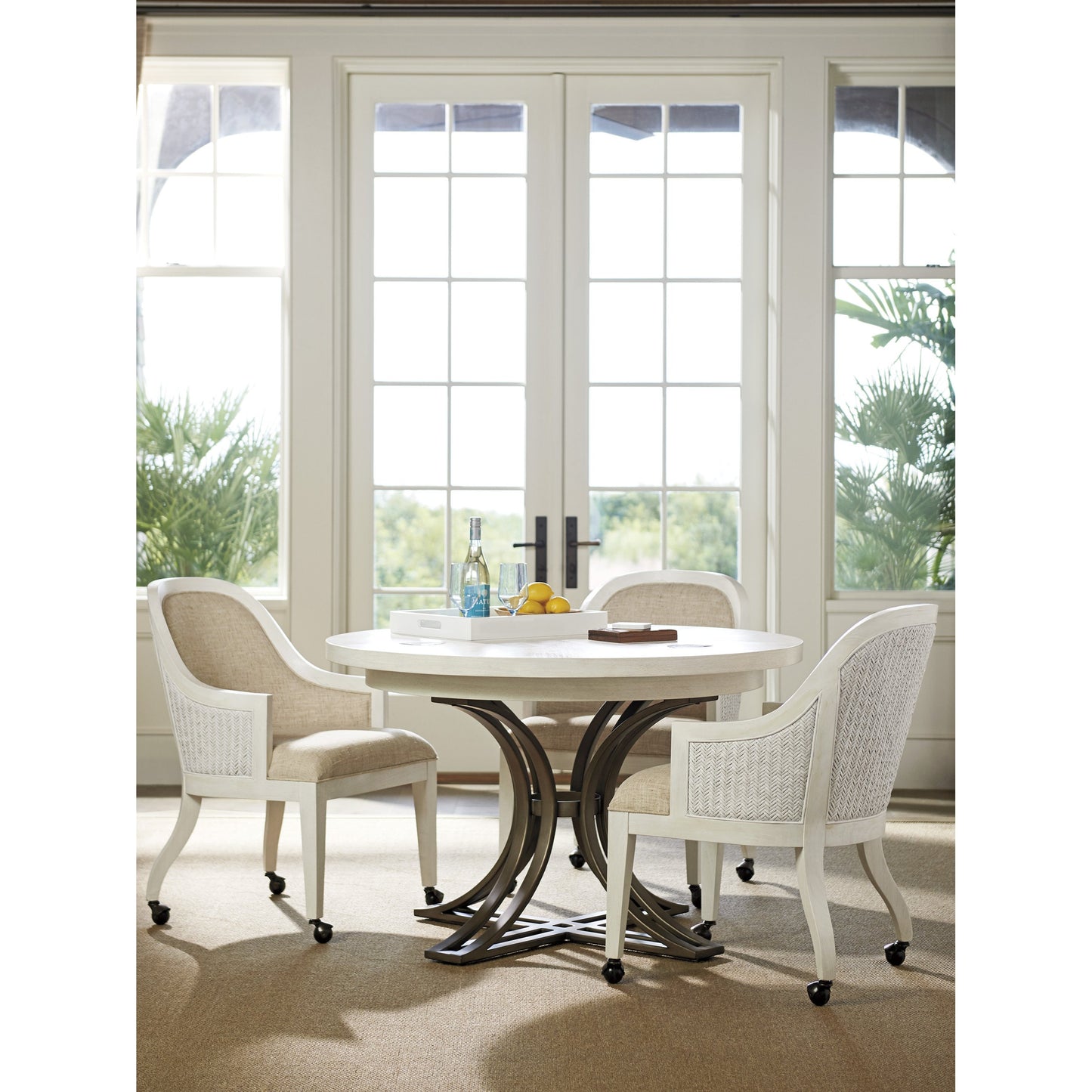 006 SR-835954 | Lifestyle | Bayview Arm Chair with Casters by Tommy Bahama Home in natural. Made from unique in a transitional style.