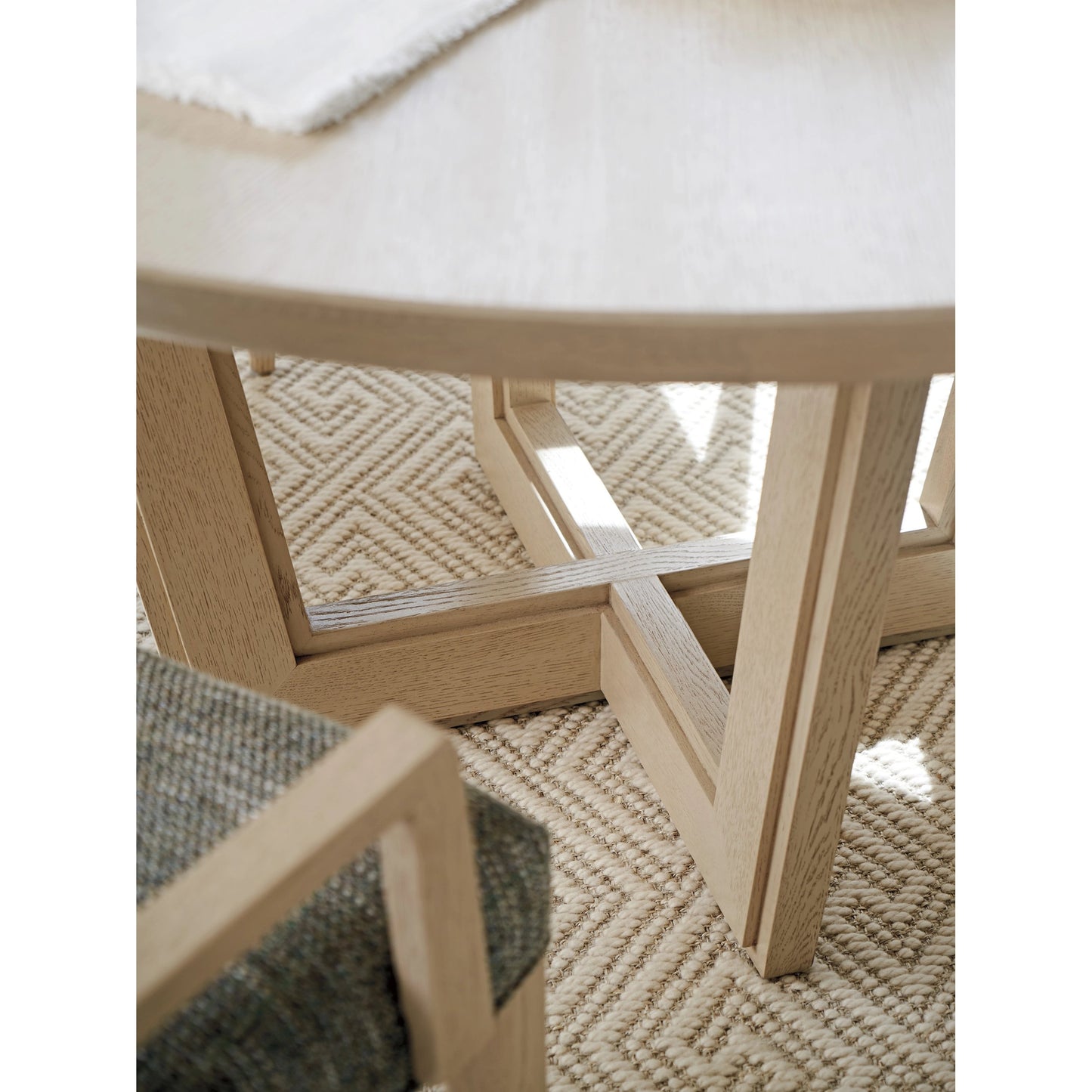 006 SI-2136885 | Closeup | Hanson Round Dining Table by Tommy Bahama Home in sand drift. Made from unique in a modern style.