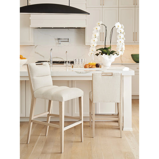 Greer Channeled Upholstered Bar Stool by Tommy Bahama Home in biscayne and sand drift. Made from unique in a modern style.