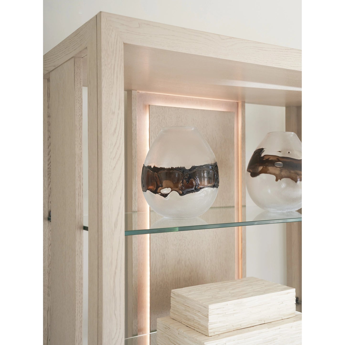 002 SI-2136912 | Closeup | Lancaster Bookcase by Tommy Bahama Home in sand drift. Made from unique in a modern style.