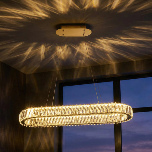 Golden Ratio Oval LED Crustal Pendant by Varaluz in gold. Made from aluminum, crystal in a unique style.