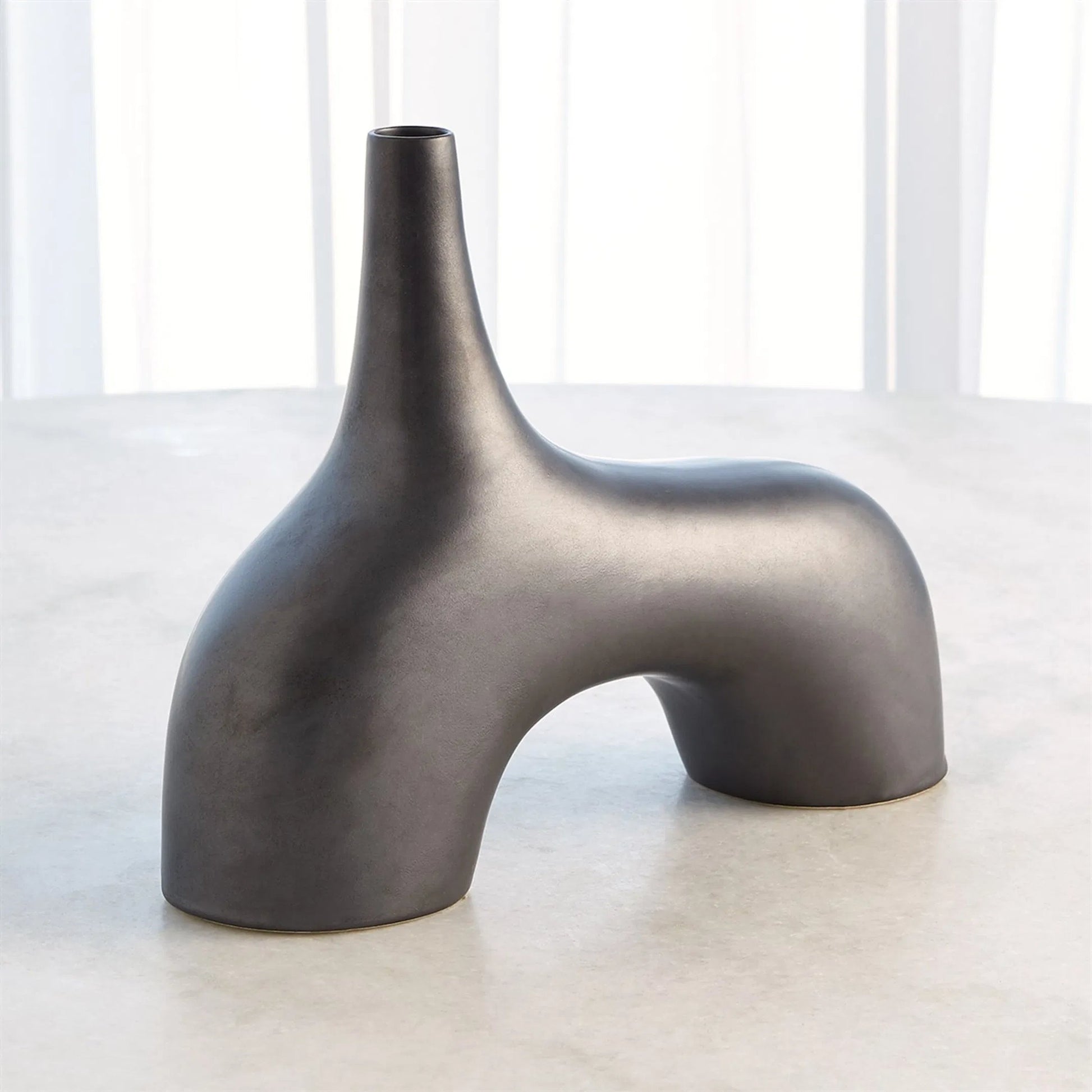 Stretch Vase by Global Views. Made from earthenware in a eclectic & global style.