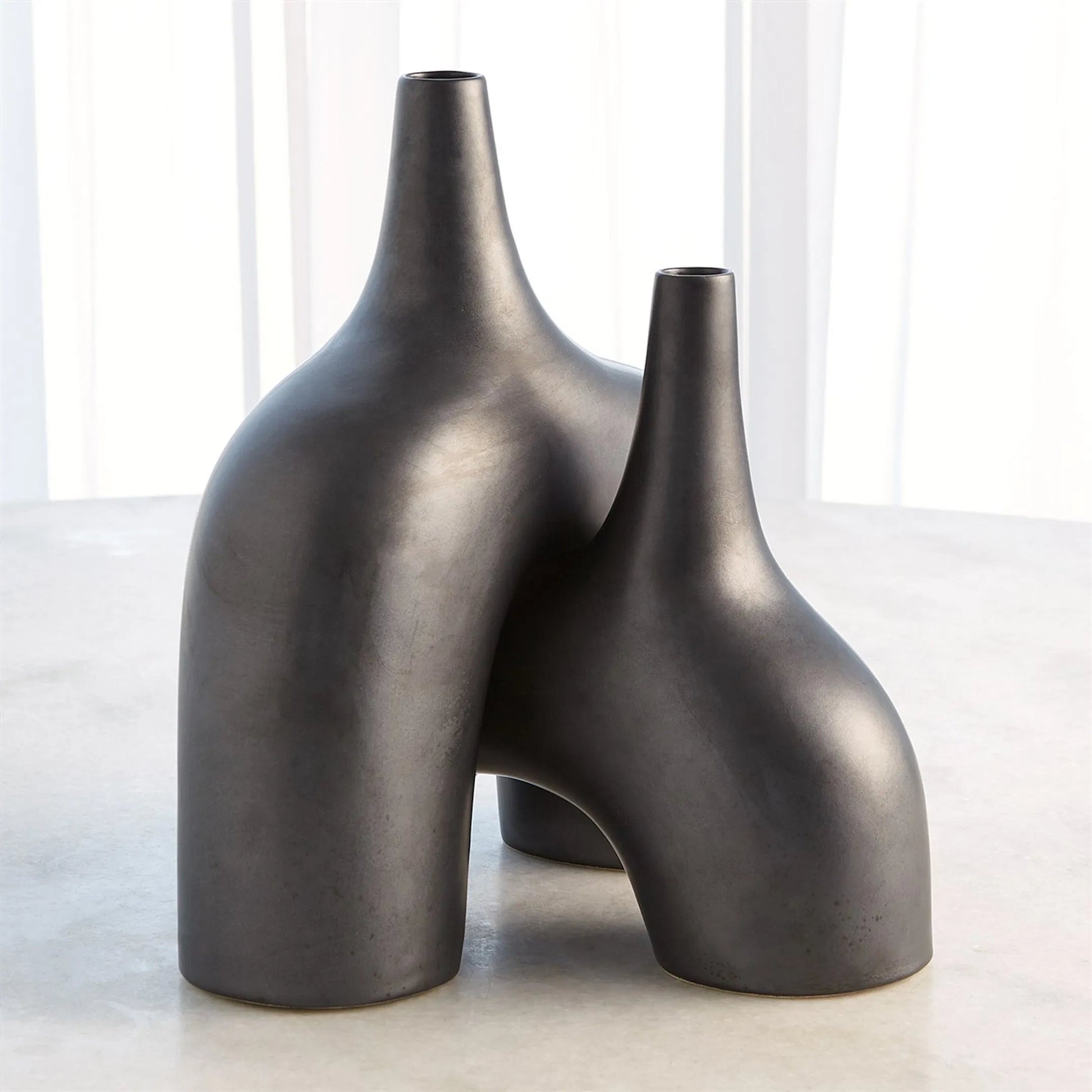 Stretch Vase by Global Views. Made from earthenware in a eclectic & global style.