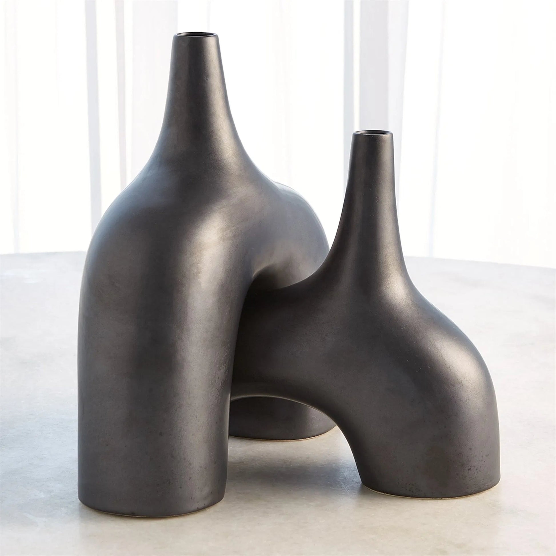 Stretch Vase by Global Views. Made from earthenware in a eclectic & global style.
