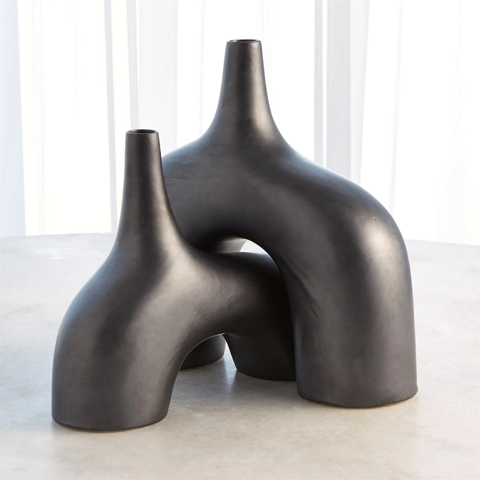 Stretch Vase by Global Views. Made from earthenware in a eclectic & global style.