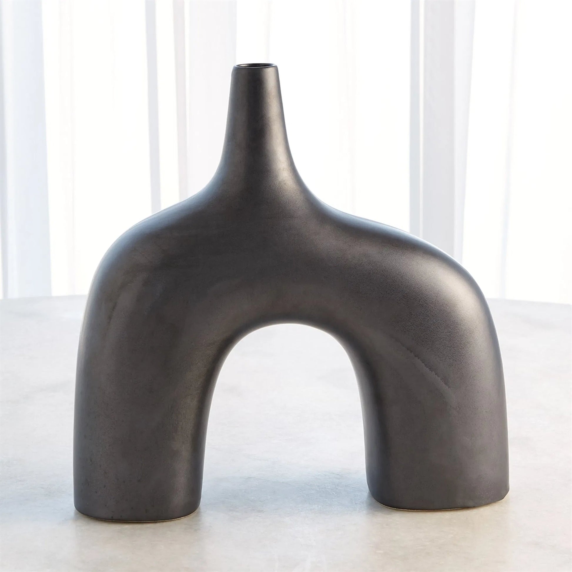 Stretch Vase by Global Views. Made from earthenware in a eclectic & global style.