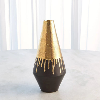 Gold Drip Vase by Global Views in gold. Made from unique in a modern style.