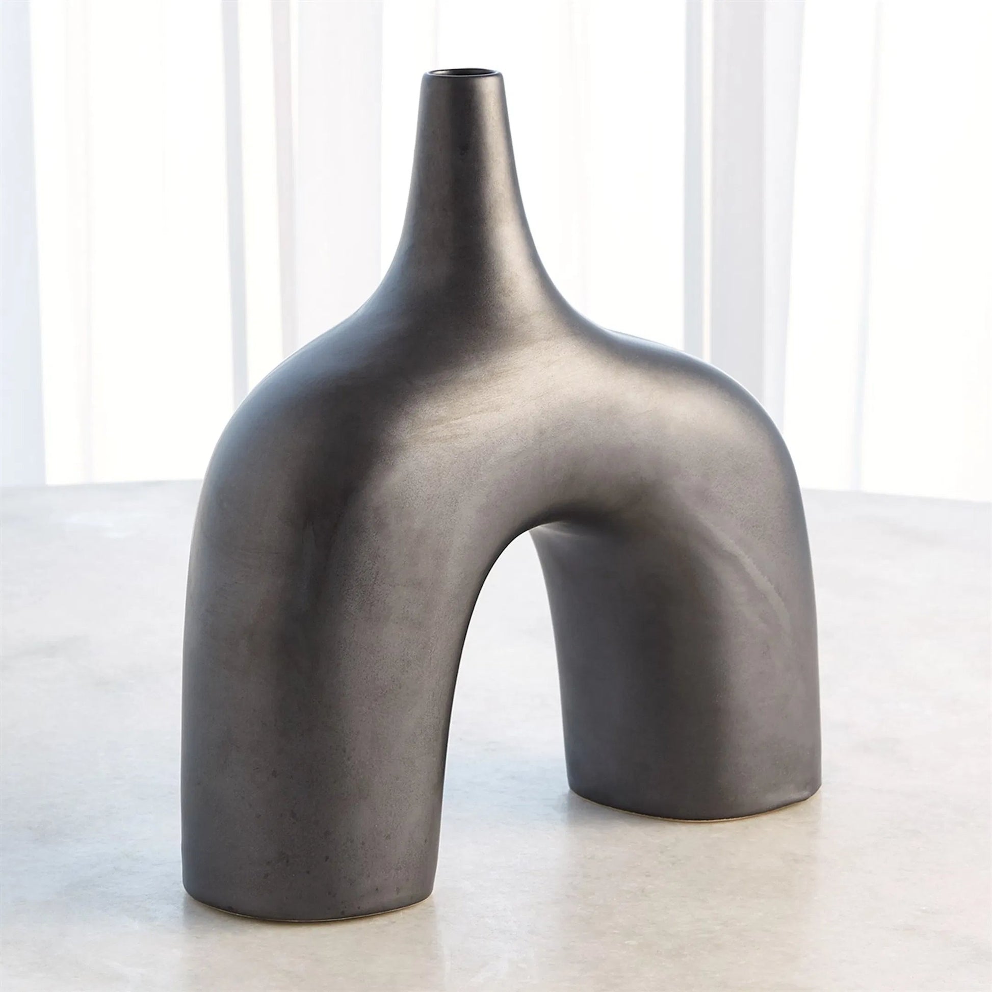 Stretch Vase by Global Views. Made from earthenware in a eclectic & global style.