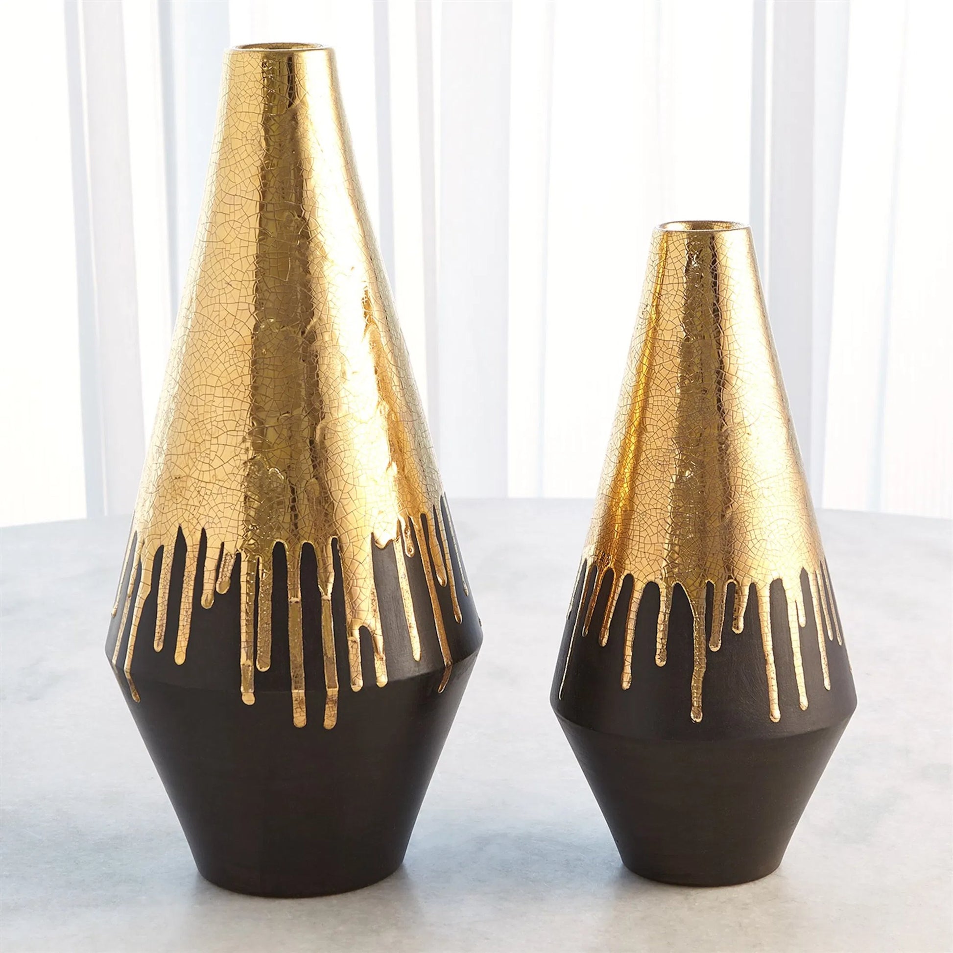 Gold Drip Vase by Global Views in gold. Made from unique in a modern style.