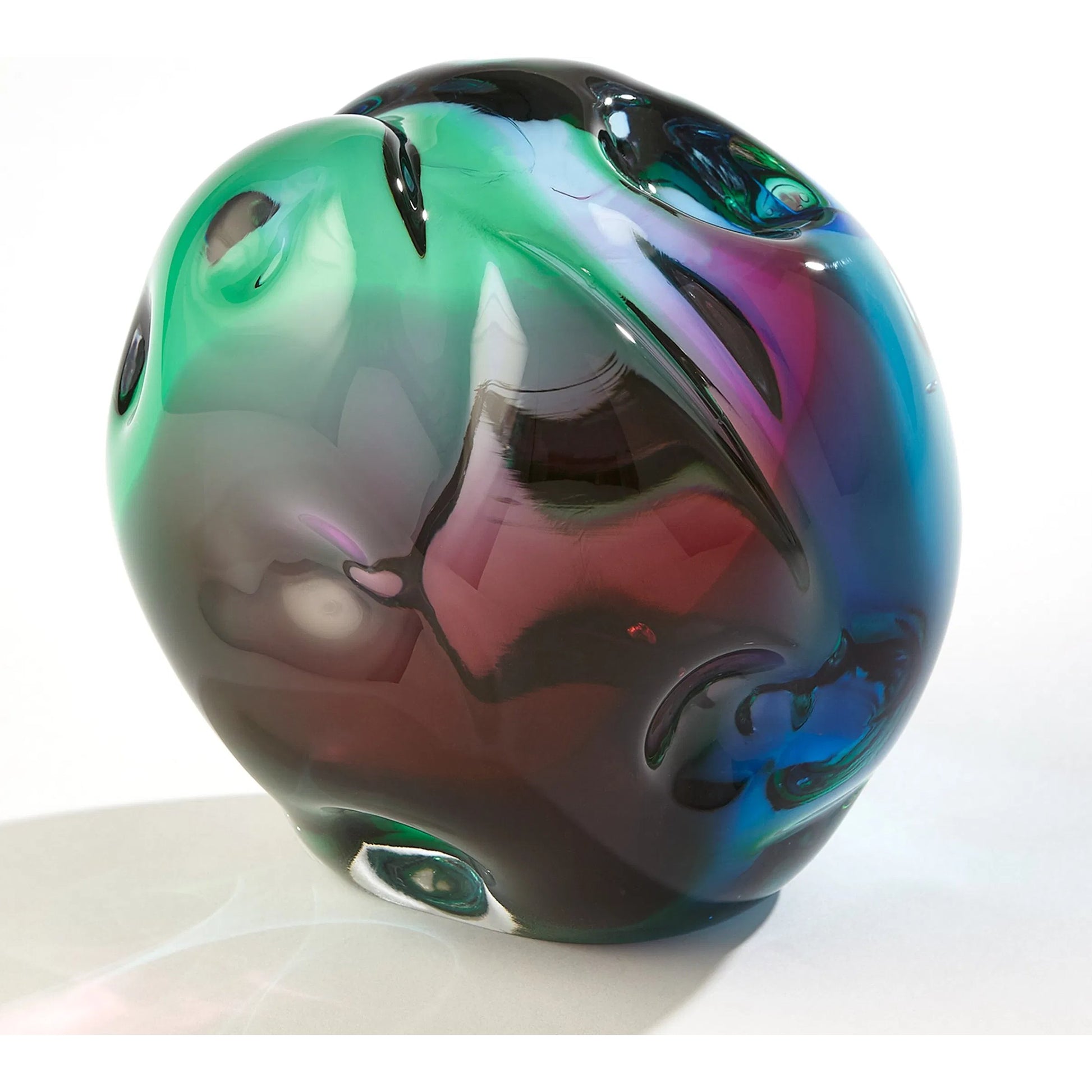 Dimpled Sphere by Global Views. Made from art glass in a eclectic & global style.