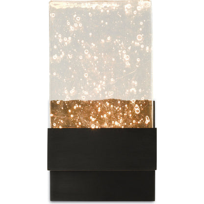 Penzance Wall Sconce by Currey and Company in oil rubbed bronze. Made from metal, seeded glass in a modern style.