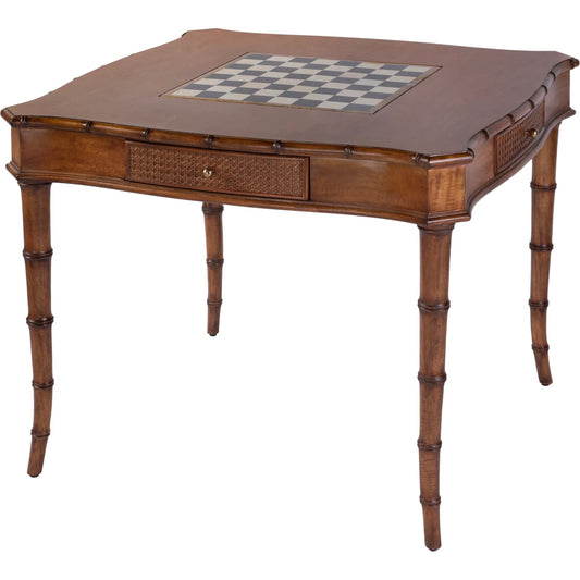 Osman Game Table by Butler Specialty Company in heritage brown. Made from gmelina wood, mdf, maple and oak veneer, stone inset, open cane, brass knob in a unique style.