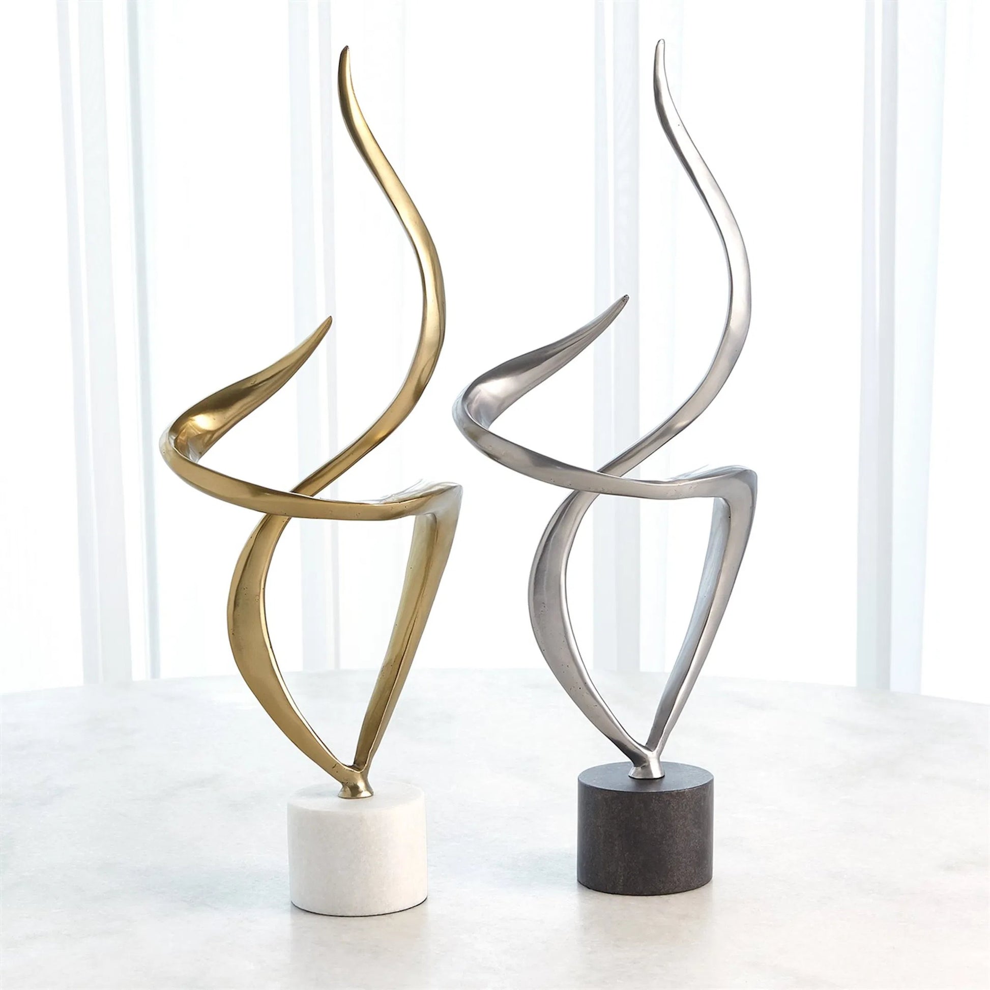 Swirl Metal Sculpture by Global Views in brass and marble. Made from unique in a transitional style.