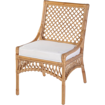 Antigua Dining Chair by Butler Specialty Company in natural rattan. Made from rattan, foam, plywood in a rustic style.