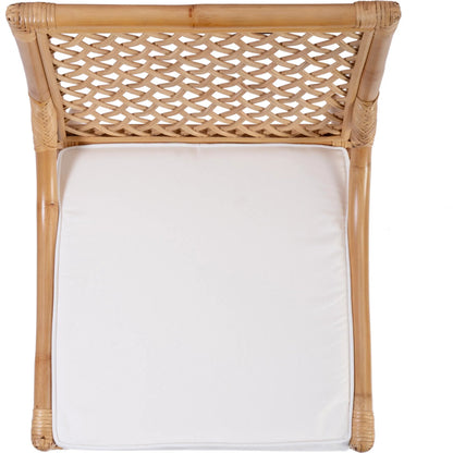 Antigua Dining Chair by Butler Specialty Company in natural rattan. Made from rattan, foam, plywood in a rustic style.