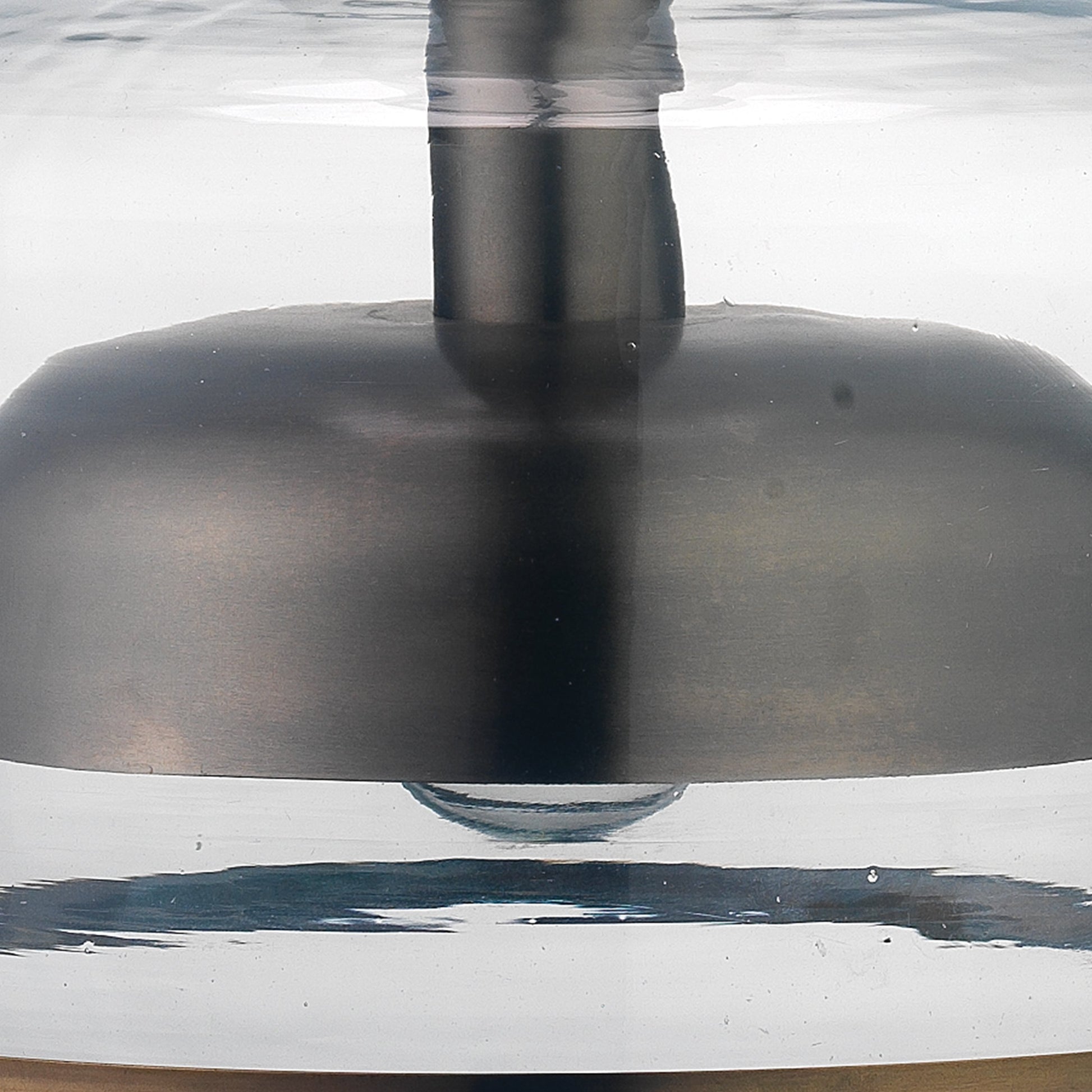 Clyde Pendant by Jamie Young in clear with gun metal. Made from glass in a modern style.