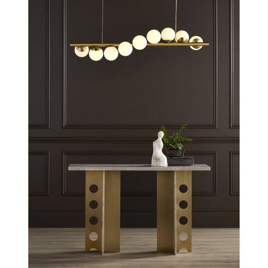 Selene Console Table by Currey and Company in natural, polished brass. Made from stone, iron in a modern style.