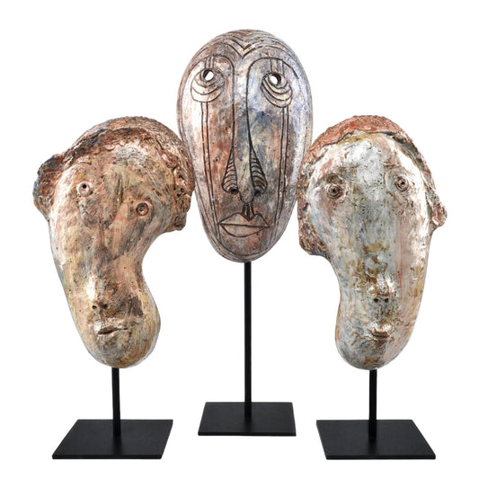Glazed Masks Set by Currey and Company in assorted ceramic glaze. Made from ceramic, iron in a modern style.