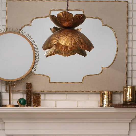 Flowering Lotus Pendant by Jamie Young in antique gold. Made from metal in a modern style.