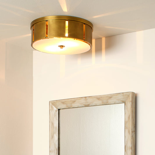 Orbit Flush Mount Ceiling Light by Jamie Young in antique brass. Made from metal in a modern style.