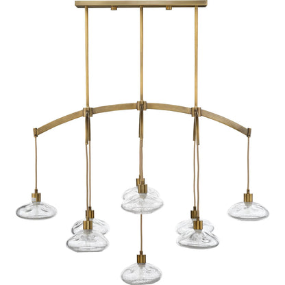 Reservoir Chandelier by Jamie Young in antique brass. Made from glass in a unique style.