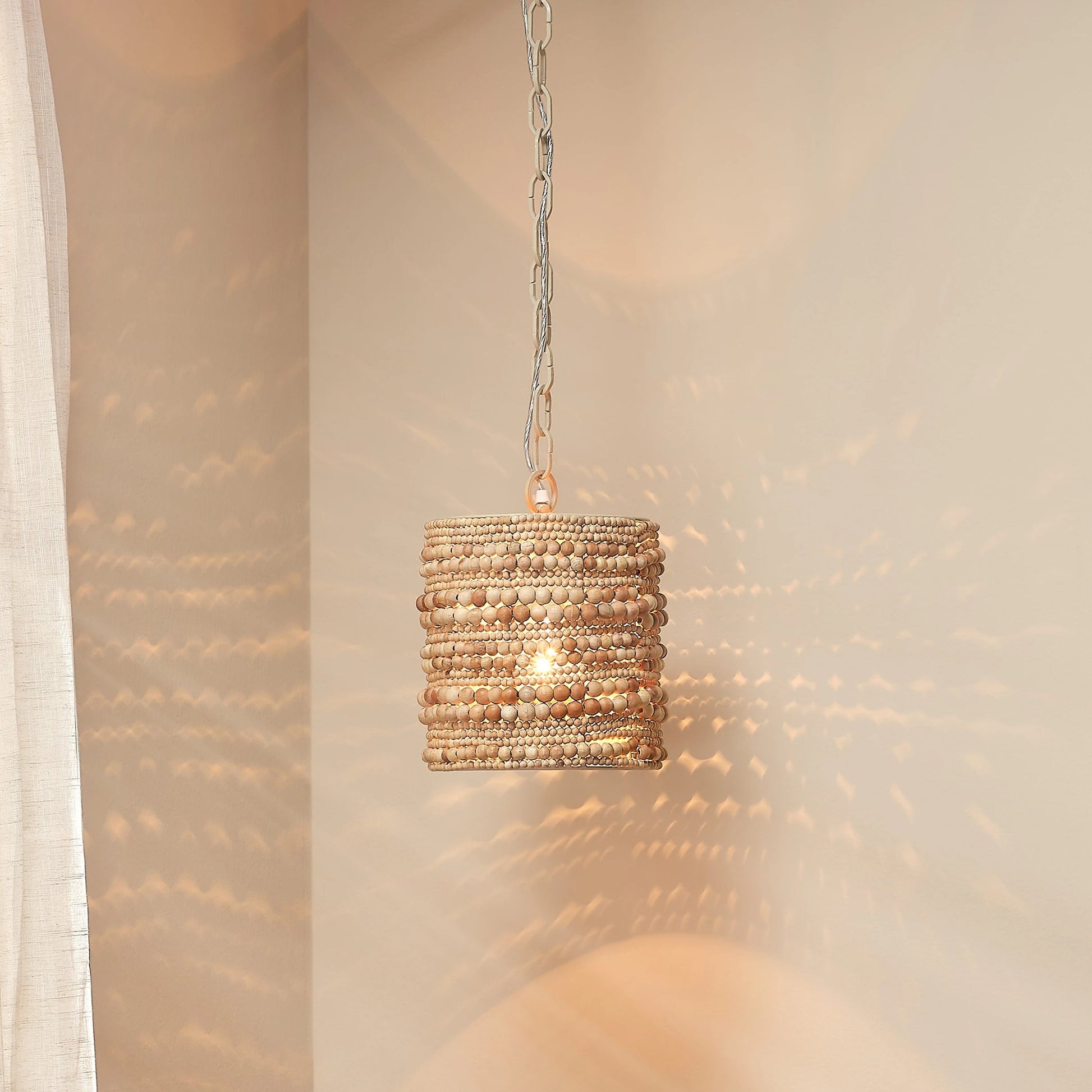Strand Pendant by Jamie Young. Made from mango wood, metal: iron in a coastal style.