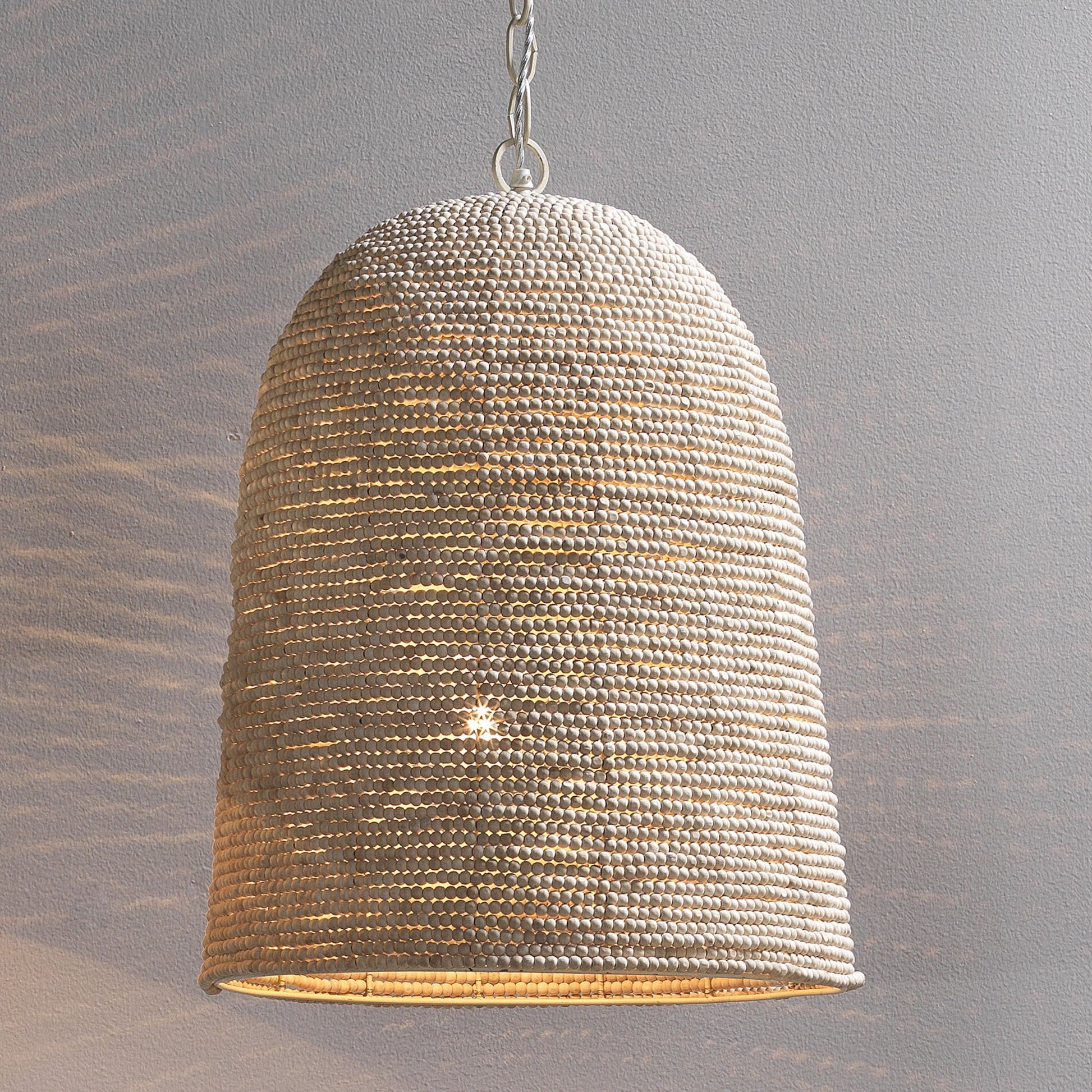 Waterfront Pendant by Jamie Young in off white. Made from iron, mango wood in a coastal style.